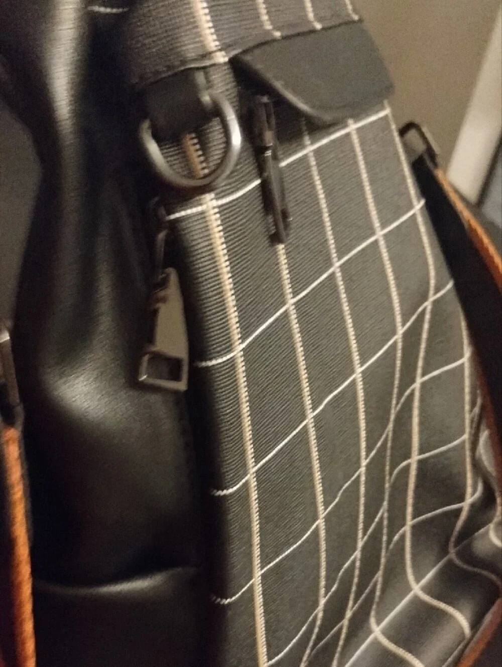 Black Grid-Pattern Backpack with Contrast Brown Strap